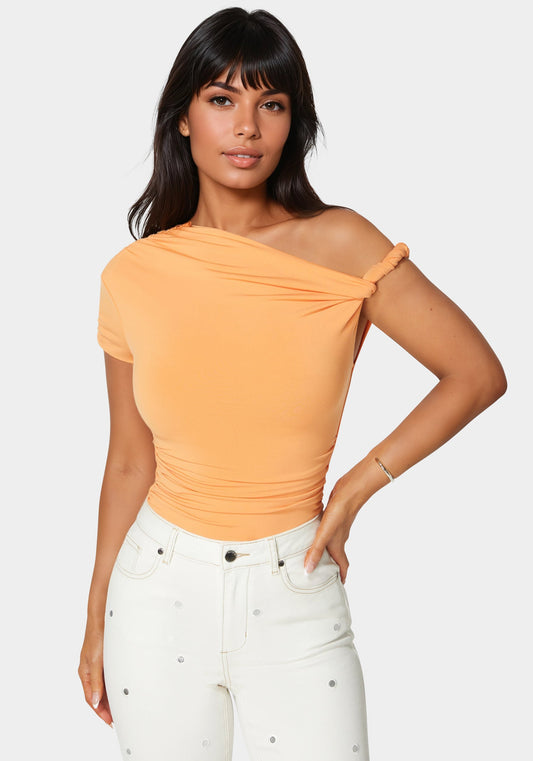 Asymmetrical Shoulder Ruched Bodysuit in Cantaloupe - bebe Cantaloupe - bebe